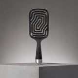 Image of Neal & Wolf HERØ Flexi Detangling Hair Brush with promo background