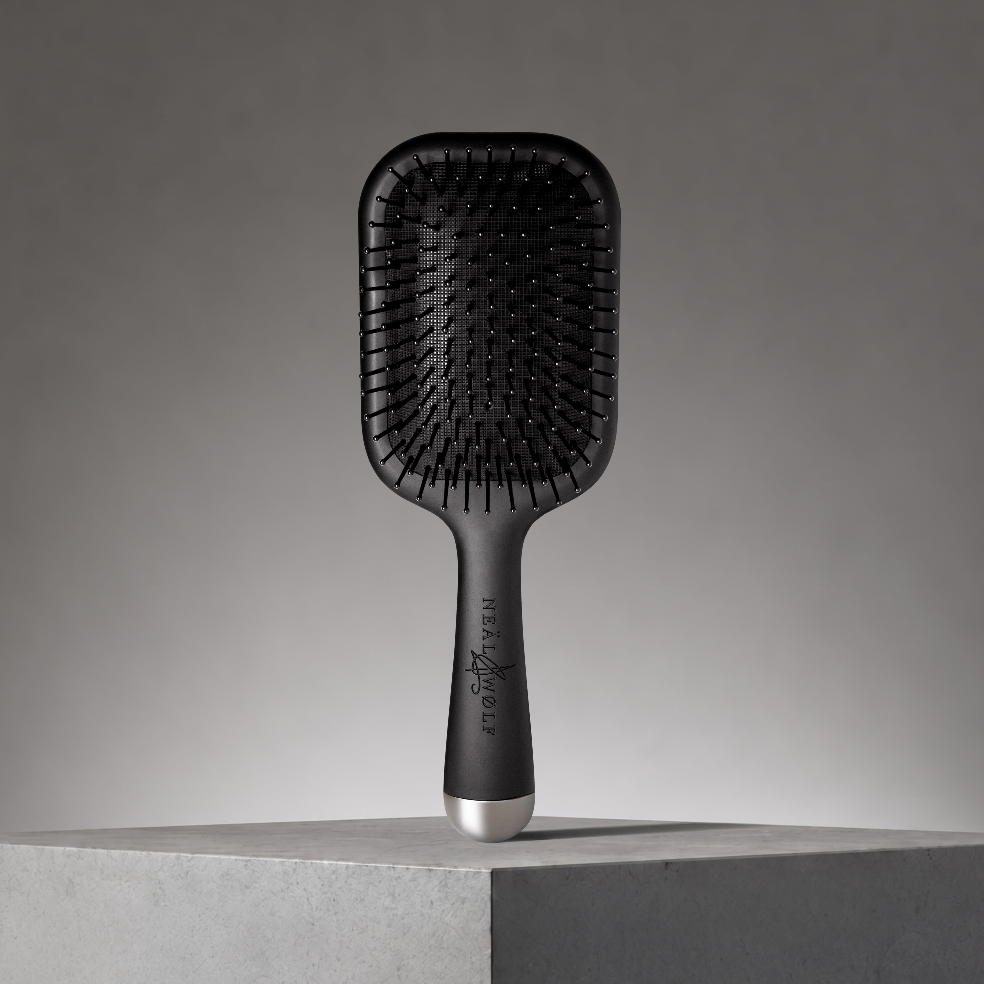 Image of Neal & Wolf HERØ Paddle Hair Brush with promo background